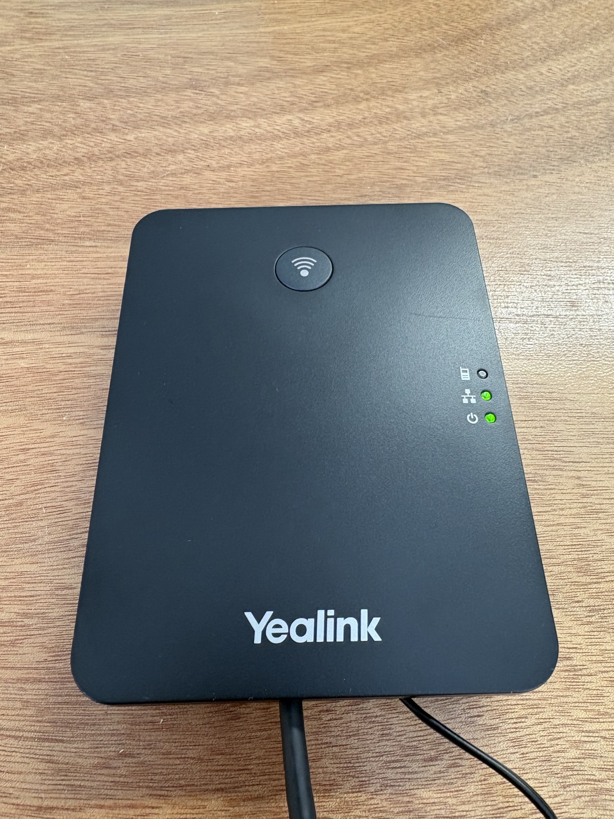 Front of a Yealink W70B base showing the power and network lights